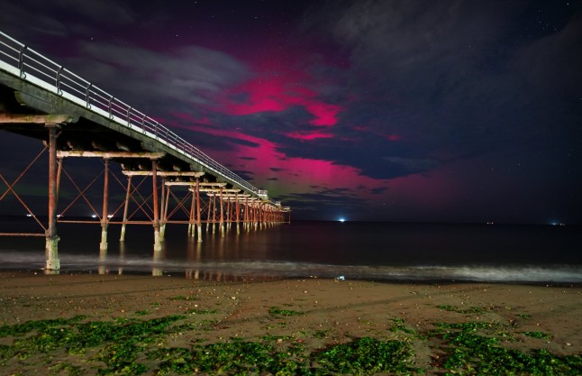 The Northern Lights visible through clouds over Saltburn-by-the-Sea in North Yorkshire. Picture date: Tuesday September 2, 2025. PA Photo. The Northern Lights were visible across parts of the UK and Ireland overnight and may appear again on Tuesday following a powerful solar storm. Photo credit should read: Owen Humphreys/PA Wire