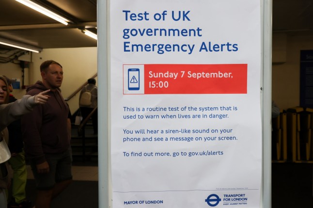 ? Licensed to London News Pictures. 04/09/2025. London, UK. A commuter point at a Government notice about the upcoming ?UK Emergency Alerts Test? displayed at a London Underground station. The UK Government will conduct a national test of the Emergency Alerts system on Sunday, 7 September 2025, at 3pm. The test is part of ongoing efforts to enhance national resilience and protect communities in the event of life-threatening emergencies. Photo credit: Dinendra Haria/LNP