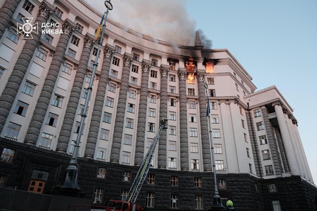 This handout photograph posted on September 7, 2025 on the official Telegram channel of Ukrainian Prime Minister Yulia Svyrydenko shows rescue personnel working to extinguish a fire at the Ukrainian government building in Kyiv, following an overnight attack amid the Russian invasion of Ukraine. Russian strikes across Ukraine overnight killed at least four people and wounded dozens more, authorities announced, as officials said a government building in the capital Kyiv was on fire after the attack. (Photo by Handout / Official Telegram channel of Ukrainian Prime Minister Yulia Svyrydenko / AFP) / RESTRICTED TO EDITORIAL USE - MANDATORY CREDIT "AFP PHOTO / Official Telegram channel of Ukrainian Prime Minister Yulia Svyrydenko" - NO MARKETING - NO ADVERTISING CAMPAIGNS - DISTRIBUTED AS A SERVICE TO CLIENTS (Photo by HANDOUT/Official Telegram channel of Ukrainian Prime Minister Yulia Svyrydenko/AFP via Getty Images)
