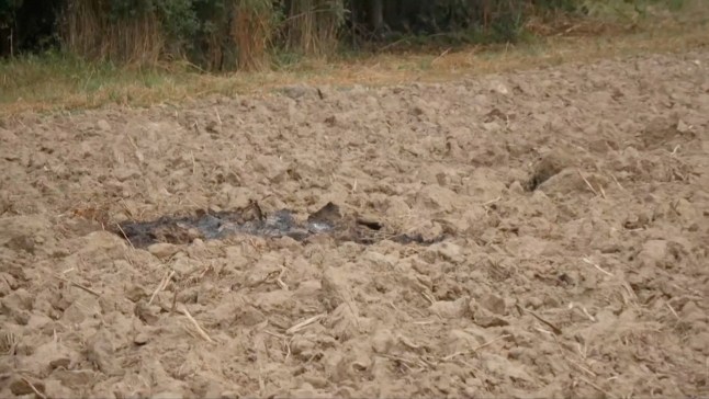 Parts of a damaged UAV shot down by Polish authorities lie at a site near Zamosc, Jaroslawiec region, Poland, September 10, 2025, in this screengrab obtained from a video. TVN/Handout via REUTERS THIS IMAGE HAS BEEN SUPPLIED BY A THIRD PARTY. POLAND OUT. NO COMMERCIAL OR EDITORIAL SALES IN POLAND