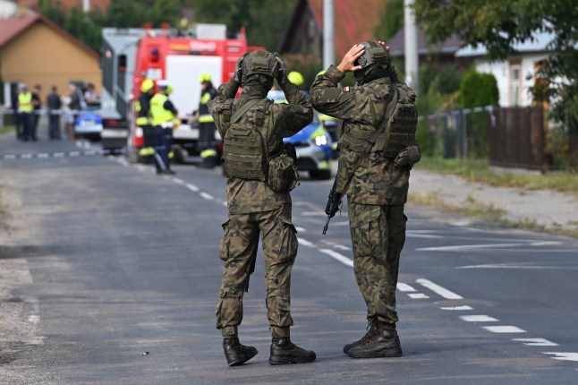 epa12366588 Polish Army and emergency services inspect the site after a Russian drone damaged the roof of a residential building in Wyryki, eastern Poland, 10 September 2025. Russian drones repeatedly violated Polish airspace overnight. EPA/WOJTEK JARGILO POLAND OUT