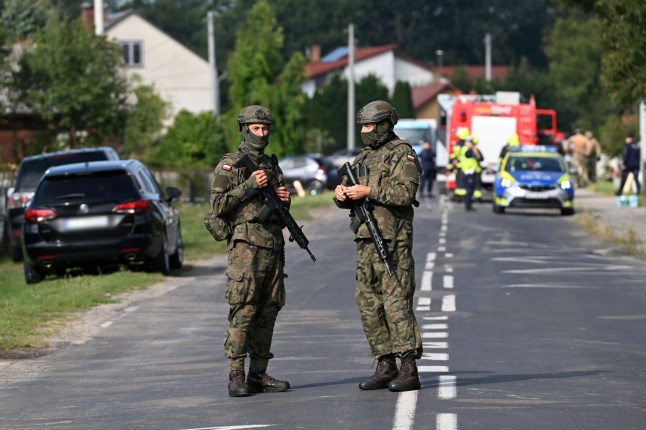 epa12366592 Polish Army and emergency services inspect the site after a Russian drone damaged the roof of a residential building in Wyryki, eastern Poland, 10 September 2025. Russian drones repeatedly violated Polish airspace overnight. EPA/WOJTEK JARGILO POLAND OUT