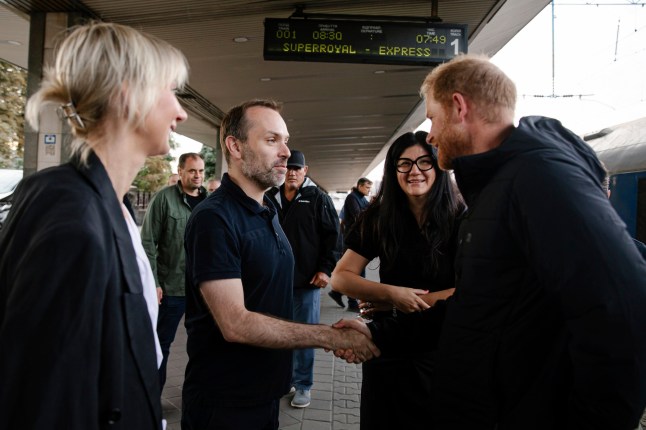 In this photo provided by the Railway of Ukraine Ukrzaliznytsia on Friday, Sept. 12, 2025, Britain's Prince Harry, right, arrives on central railway station in Kyiv region, Ukraine.
