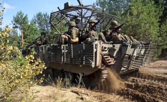epa12370967 A still image taken from a handout video provided by the Russian Defence Ministry press service on 12 September 2025 shows soldiers riding on an armored vehicle during the Zapad-2025 joint military drills at an undisclosed location in Belarus. The 'Zapad 2025' joint strategic military exercise will be conducted by the Russian and Belarusian armed forces from 12 to 16 September 2025. EPA/RUSSIAN DEFENCE MINISTRY PRESS SERVICE HANDOUT HANDOUT EDITORIAL USE ONLY/NO SALES