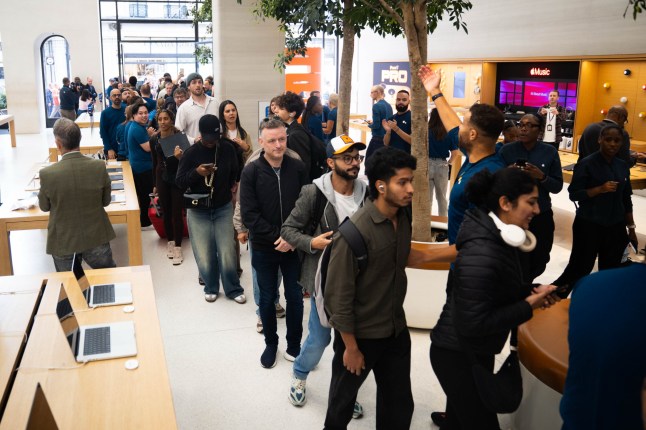 The first customers enter the Apple Store in Regent Street, central London, as the new Apple iPhone 17 goes on sale in the UK.