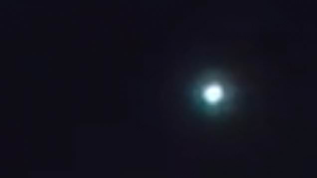 The green 'meteor' in the sky.