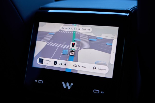 epa11731965 A Waymo autonomous self-driving Jaguar robotaxi screen displays an arrival time as it drives down the road in Los Angeles, California, USA, 20 November 2024. On 12 November 2024, Waymo opened its autonomous self-driving robotaxi service to anyone in a nearly 80 square mile area of Los Angeles County, marking its largest expansion yet. Waymo, owned by Google parent Alphabet, closed a $5.6 billion funding round in October to expand its robotaxi service across the US. EPA/ALLISON DINNER