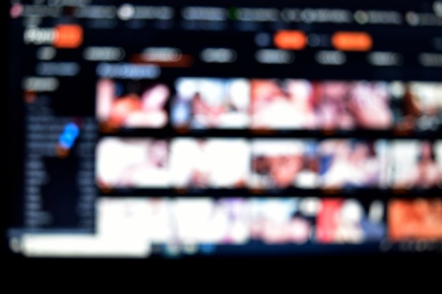 close up of bokeh pronographic page on internet, shallow depth of field of porn website on internet; Shutterstock ID 1628096437; purchase_order: -; job: -; client: -; other: -