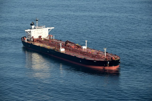 This aerial picture taken on October 1, 2025 off the coast of the western France port of Saint-Nazaire shows the tanker Boracay from Russia's so-called "shadow fleet" suspected of being involved in drone flights over Denmark which sailed off the Danish coast between September 22 and 25. Named the Pushpa or Boracay, the Benin-flagged vessel, which is blacklisted by the European Union for being part of Russia's sanction-busting "shadow fleet", has been immobilised for several days off the French coast. (Photo by Damien MEYER / AFP) (Photo by DAMIEN MEYER/AFP via Getty Images)
