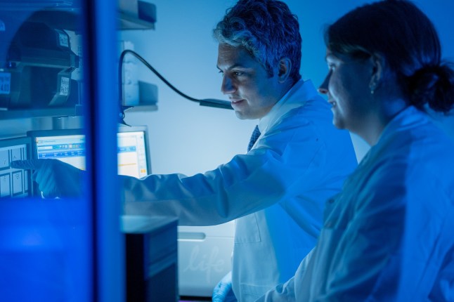 EMBARGOED TO 1600 WEDNESDAY OCTOBER 22 Undated handout photo issued by UF Health of Elias Sayour (left), working on a COVID-19 vaccine in a lab. Research suggests that vaccines for Covid-19 have been found to "turbo-charge" a certain type of cancer treatment which harnesses the immune system to attack cancer cells. Academics said that the finding, once confirmed in wider studies, could "revolutionise" cancer care. Issue date: Wednesday October 22, 2025. PA Photo. Photo credit should read: UF Health/Jackie Hart/PA Wire NOTE TO EDITORS: This handout photo may only be used for editorial reporting purposes for the contemporaneous illustration of events, things or the people in the image or facts mentioned in the caption. Reuse of the picture may require further permission from the copyright holder.
