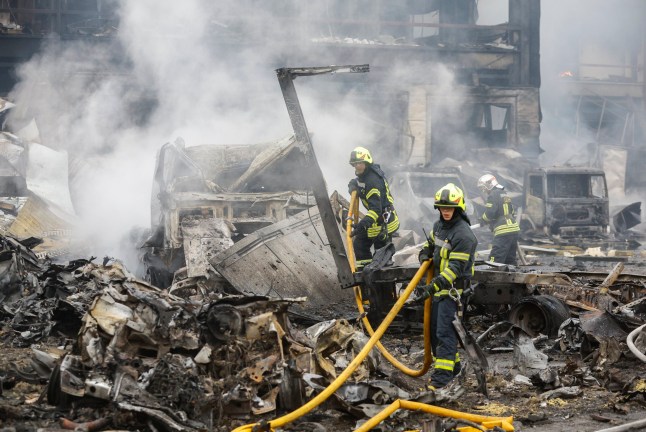 epa12480957 Ukrainian rescuers work at the site of a Russian missile strike in Kyiv, Ukraine, 25 October 2025, amid the Russian invasion. At least two people were killed and 13 others injured after Russian forces launched an overnight attack on Kyiv, the State Emergency Service of Ukraine reported. EPA/SERGEY DOLZHENKO