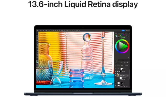 Apple laptop showing the screen with graphics