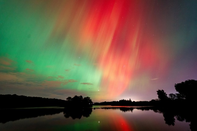 Northern Lights over Banton Loch, Kilsyth, North Lanarkshire. October 10 2024. Photo released October 11. 2024.