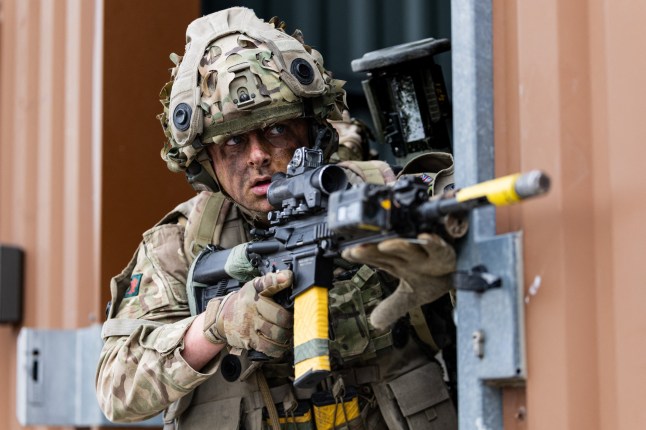 A soldier takes part in urban combat exercise during a joint military manoeuvre between the French and British army at the Sissonne camp, north of the city of Reims, in northeastern France on April 22, 2025. Amid the soulless blocks of the ghost town of Jeoffrecourt, in north-eastern France, French and British soldiers train together in urban combat, learning the lessons of the war in Ukraine. (Photo by Sameer Al-DOUMY / AFP) (Photo by SAMEER AL-DOUMY/AFP via Getty Images)
