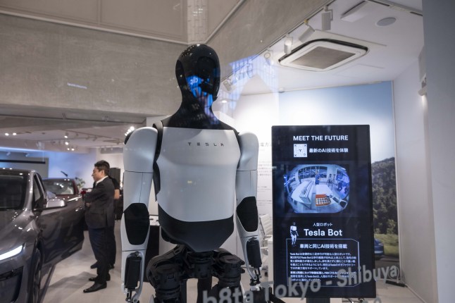 Mandatory Credit: Photo by Stanislav Kogiku/SOPA Images/Shutterstock (15271763o) Tesla Optimus humanoid robot on display inside the Tesla pop-up store near Shibuya crossing. In April 2025, Tesla opened a pop-up store in Shibuya, Tokyo, strategically located just a minute's walk from Shibuya Station. The store showcases the new Model Y and Model 3, along with the Optimus robot, offering an interactive experience for visitors. This temporary setup aims to boost brand visibility and engage potential customers in one of Tokyo's busiest districts, aligning with Tesla's strategy to expand its presence in Japan's electric vehicle market. Tesla pop-up store in Shibuya, Tokyo - 25 Apr 2025