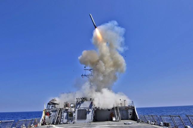 AT SEA - MARCH 29, 2011: In this handout released by the U.S. Navy, the U.S. Navy guided-missile destroyer USS Barry (DDG 52) launches a Tomahawk cruise missile in support of Operation Odyssey Dawn March 29, 2011 from the Mediterranean Sea.. In a response to a alleged chemical weapons attack on its own people by the Syrian regime the USS Mahan, the USS Barry, the USS Ramage, and the USS Gravely, all Arleigh Burke-class destroyers carrying Tomahawk land-attack missiles, are en route or in position in the eastern Mediterranean for a possible strike on Syrian military assets on August 28, 2013. (Photo by U.S. Navy via Getty Images)