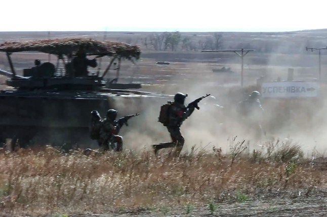 In this image made from video provided by the Russian Defense Ministry Press Service on Friday, Oct. 31, 2025, Russian servicemen attend a practice for sabotage operations behind enemy lines at a training ground on an undisclosed location. (Russian Defense Ministry Press Service via AP)