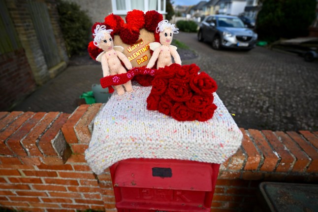 WEYMOUTH, ENGLAND - FEBRUARY 11: A Happy Valentine's Day themed knitted postbox topper is seen, on February 11, 2024 in Weymouth, United Kingdom. (Photo by Finnbarr Webster/Getty Images)