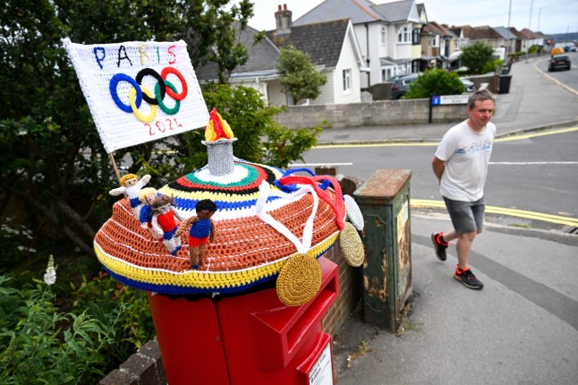 WEYMOUTH, ENGLAND - JULY 24: A knitted Olympic Games Paris post box topper is seen, on July 24, 2024 in Weymouth, United Kingdom. (Photo by Finnbarr Webster/Getty Images)