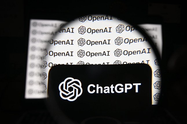 The logos of OpenAI and ChatGPT are seen displayed on a smartphone