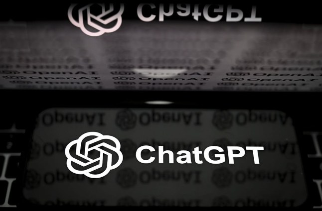 The logos of OpenAI and ChatGPT are seen displayed on a smartphone
