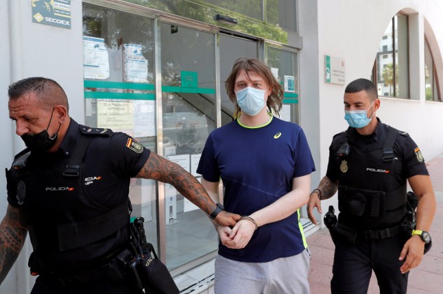 22-year-old British citizen Joseph James O'Connor is lead by Spanish police officers as he leaves a court after being arrested in connection with an alleged July 2020 Twitter hack which compromised the accounts of high-profile politicians and celebrities, according to the U.S. Justice Department, in Estepona, Spain, July 22, 2021. REUTERS/Jon Nazca