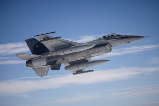 This photograph taken aboard a French Air Force Airbus A330 MRTT (Multi Role Tanker Transport), over Greek territorial waters, October 4, 2024 shows a Romanian Air Force F-16 fighter jet waiting for an aerial refueling, while they participate in the "Ramstein Flag 2024" exercice. With the participation of 12 allied countries, NATO Air Command is organizing this exercise from September 30 to October 10, 2024. Led by Allied Air Command and hosted by the Hellenic Air Force, the Ramstein Flag exercise aims to strengthen cooperation, interoperability and integration between the Allies. Featuring 130 fighters and support aircrafts, this exercise is the first in the "Flag" series, and will continue until 2025. (Photo by CLEMENT MAHOUDEAU / AFP) (Photo by CLEMENT MAHOUDEAU/AFP via Getty Images)
