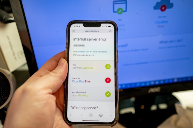 Person's handing hold an iPhone displaying a Cloudflare Error while attempting to access a webpage, during an outage of the Cloudflare service, Lafayette, California, November 18, 2025. (Photo by Smith Collection/Gado/Getty Images)