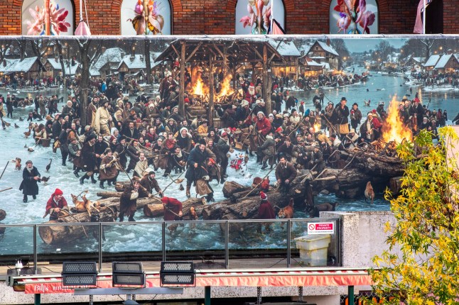 The massive mural was installed ahead of the Christmas season, along Riverside Walk in Kingston upon Thames, southwest London (Credits: Rob Todd for Daily Mail)