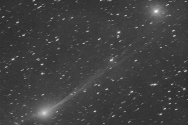 The interstellar comet 3I/Atlas as it streaks through space, 190 million miles from Earth (Picture: Gianluca Masi via AP)