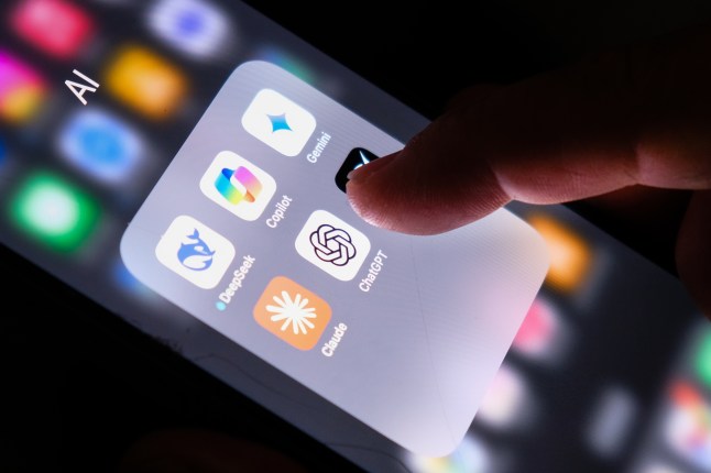 Artificial Intelligence icons internet AI app application. Chat GPT and Copilot are among the apps that can be seen. Someone's thumb is also visible.
