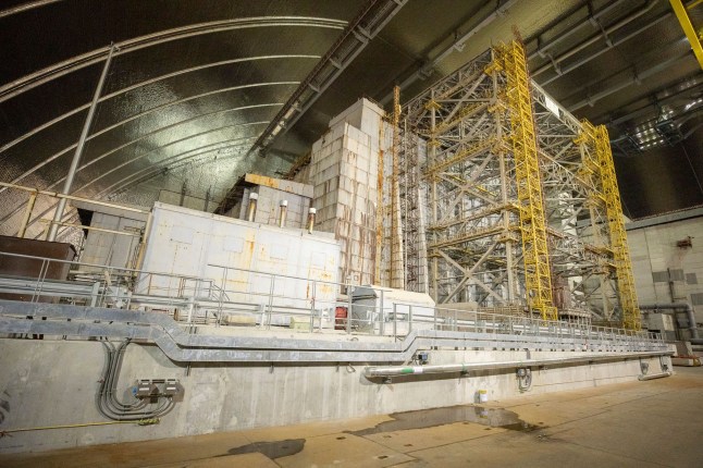A view inside the "new safe confinement" shelter that spans the remains of the Chernobyl nuclear power plant's Reactor No. 4, in Chernobyl, Ukraine, Wednesday, July 10, 2019. A structure built to confine radioactive dust from the nuclear reactor at the center of the 1986 Chernobyl disaster was formally unveiled on Wednesday. (Ukrainian Presidential Press Office via AP)