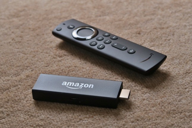 Tokyo/Japan - May 2, 2020: amazon fire tv stick remote. During COVID-19 lockdown, people stay home and watch TV drama, documentary, and movies on Netflix, HULU, YouTube etc; Shutterstock ID 1727244985; purchase_order: -; job: -; client: -; other: -