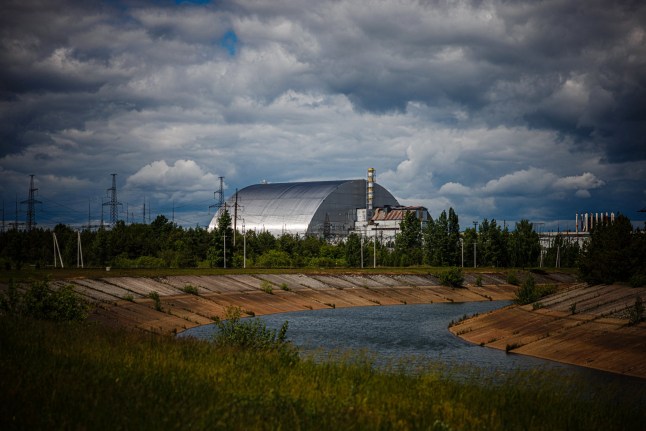 A photograph shows the New Safe Confinement at Chernobyl Nuclear Power Plant which cover the number 4 reactor unit on May 29, 2022, amid the Russian invasion of Ukraine. Ukraine's President Volodymyr Zelensky said on February 14. 2025 that a Russian drone had struck a cover built to contain radiation at the Chernobyl nuclear power plant, adding that "radiation levels have not increased".