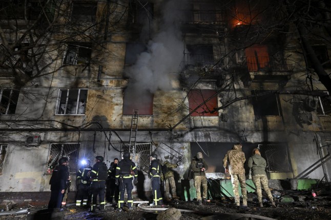 Firefighters and police officers work at the site of an apartment building which was damaged during an evening Russian drone strike, amid Russia's attack on Ukraine, in Zaporizhzhia, Ukraine November 25, 2025. REUTERS/Stringer