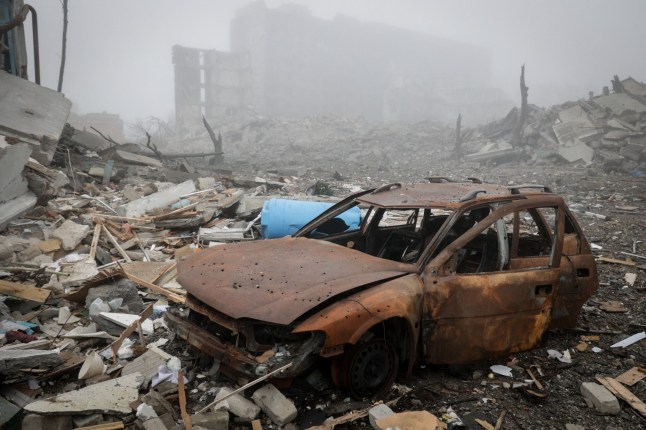 A destroyed car lies near apartment buildings damaged by Russian military strike, amid Russia's attack on Ukraine, in the frontline town of Kostiantynivka in Donetsk region, Ukraine November 28, 2025. Oleg Petrasiuk/Press Service of the 24th King Danylo Separate Mechanized Brigade of the Ukrainian Armed Forces/Handout via REUTERS ATTENTION EDITORS - THIS IMAGE HAS BEEN SUPPLIED BY A THIRD PARTY.