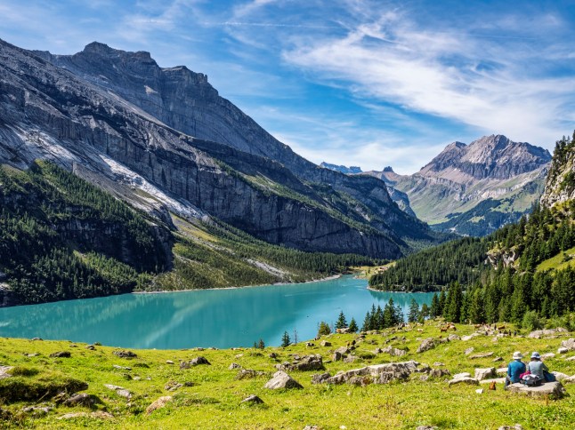 Panoramic photograph taken in September. Lake Oeschinensee (Lake Oeschinen) located near Kandersteg in the Bernese Oberland region of Switzerland. Swiss Alps, Kandersteg, Canton of Bern, Switzerland. Europe