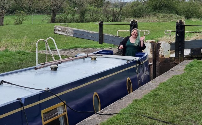 Story from Jam Press (Christmas On Narrowboat) Pictured: Tish inside her 57ft narrowboat. 'We live on a 57ft narrowboat to save on rent and bills ? we have to move every TWO weeks, but it's worth it' A couple living on a 57ft narrowboat in a bid to save on rent and bills has revealed they have to move every two weeks ? but says it?s worth it. Tish and Josh made the decision to leave their traditional abode for a home on the water due to rising living costs in the UK. The pair, aged 36 and 35, now move locations every two weeks, which they say feels a bit like a ?holiday?. Even though the lifestyle looks ? and sounds ? appealing, it doesn?t come without its issues. Despite dealing with mounting rubbish, plus less time on their hands, they wouldn?t trade it for anything, including at Christmas. Especially as the holiday is set to be a scorcher for them, even though it?ll be just 14 degrees outside. ?Christmas will be hot,? the photographer, from Staffordshire, told?What's The Jam. ?Everyone assumes a boat will be cold in winter, but it?s [currently] 24 degrees inside. ?We don?t have the space for a tree in our boat, so we decorate our ceiling instead, and I have a friend who made us custom-made door bows to fit our tiny doors. ?It?s an incredibly cosy festive place to be.? The pair moved onto their boat in early 2024 after rising rent costs and the housing market left them rethinking things. She said: ?It was always part of our long-term plan to move onto a boat. ?We planned to retire to one, and then one day we asked ourselves why we were having the mindset that we needed to wait until our 60s to have the life we dreamed of. ?Our rent was continually going up, and the goal posts for the housing market kept moving. ?We?d been saving for years and never stopped to think about whether we even really wanted to buy a house or if it was just something we were taught was the next thing you do. ?When we really asked ourselves what we wanted out of a house, they were all things that a boat could provide us, with the added bonus of an adventure.? And often, it feels like they?re on a never-ending holiday. Josh said: ?Food shopping is a bit like being on holiday because every few weeks you?re in a new supermarket. ?Sometimes you forget where you left your home and auto-drive to the previous place you left it. ?Because of moving regularly, we?ve visited local areas we?d never thought to go into. ?We support local businesses more because now we know better places to buy things. ?But sometimes it?ll be six months until we?re back near those places, so we have to stock and plan around travelling.? Even though they?ve been?saving themselves a fortune each month, the costs do fluctuate per season, with winter the most costly. Tish said: ?Every boat is different to how the running costs are. ?Our fire is connected to our diesel tank, so we spend a lot more on diesel than others, but we spend zero on coal. ?For us personally, when we moved out of renting, our outgoings went down by roughly ?1,000 a month. ?But we have different costs to save for, like batteries, solar panels and blacking. ?Our costs are determined by the weather; summer is much cheaper because of sunlight. ?Winter is roughly ?200 a month more for us because of the increase in diesel for running the fire and charging our batteries for electricity. ?But when we lived in a house, we paid ?190 a month in gas and electric. ?Now we have about eight months of electricity powered by sunlight.? Their main costs include ?10 a month on gas, which lasts them four months at ?40 a bottle. Their license fee is ?122 per month, which they say would be the equivalent of council tax for a house. And as their boat measures a whopping 57ft, the prices aren?t set, as they vary based on size and if it?s docked in a marina. Outside of winter, they?re forking out around ?400 in fuel, and luckily, electric is free. Tish added: ?I?m asked a lot by people what it?s like to live on a boat, and it?s hard to put into words to someone because it?s a feeling more than anything, of peace. ?It?s not just a place to live but an entirely different mindset to life. ?We felt quite held down by our belongings, and it was very liberating getting rid of 90% of the things we own. ?What we hold value to now has changed; sunlight, water, nature and our loved ones are the most valuable things in our lives. ?Some things are harder ? it?s a more time-consuming way of life ? and I can?t pop my rubbish into my wheelie bin. ?If I?m lucky, I?ll find a bin a mile walk away. ?But, until then, it?s storing it until you pass a bin. ?If a fuel boat isn?t passing where I am, then we have to fetch fuel. ?We don?t have room for a washing machine, so we have to leave our home to wash clothing. ?And it takes five hours to sail a 12-minute car journey.? ?It?s all things that take up more time ? but, for me, the benefits far outweigh any negatives. ?I?ve been a long-time sufferer of mental health, and the changes were day and night, living on water just agrees with me. ?I have seen things some people will never see with their own eyes, and the closeness to nature gives you a totally new respect for it. ?I?ve rescued a squirrel out of the canal, I?ve had ducklings asleep next to my front door, we saw a mole digging next to our window once, ducks and swans regularly knock on our boat asking for food, and I once came home to a horse escaped on the towpath ?I know that sounds very appealing, and in a world where everything costs too much, it looks like a wonderful solution to a cost-of-living crisis. ?But batteries don?t last forever, blacking is done every few years, and there are lots of other costs to factor into. ?So if it?s something you?d be considering, money is the wrong reason to do it; it's a way of life, and that?s the main reason to do it.? ENDS EDITOR'S NOTE: Video Usage Licence: (EXCLUSIVE) We have obtained an exclusive licence from the copyright holder. A copy of the licence is available on request. Video Restrictions: None.