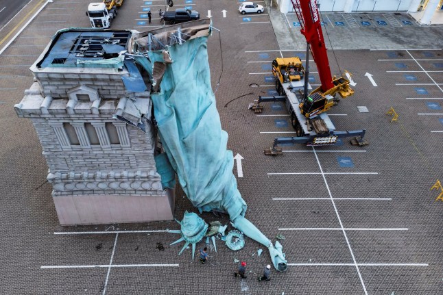 A drone view shows a replica of the Statue of Liberty, a symbol of a Brazilian retailer called Havan, toppled after being hit by strong winds that struck the city of Guaiba, Brazil.
