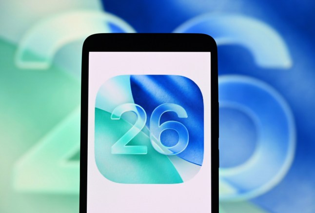 Mandatory Credit: Photo by Pavlo Gonchar/SOPA Images/Shutterstock (15368246c) In this photo illustration, the iOS 26 logo is seen on a smartphone and in the background. Photo illustration in Ukraine - 21 Jun 2025