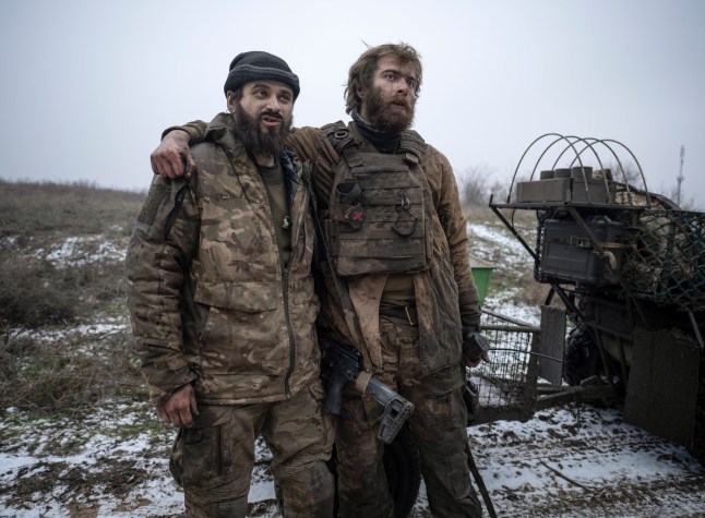 epa12598578 A handout picture made available by the press service of the 93rd Kholodnyi Yar Separate Mechanized Brigade of Ukrainian Armed Forces on 17 December 2025 shows servicemen of the 93rd Mechanized Brigade, Denis, call sign 'Bars', and Dmytro, call sign 'K2' after returning from positions near the Kostyantynivka, where they fought for 130 days straight, in the Donetsk region, Ukraine, 16 December 2025, amid the ongoing Russian invasion. Russian troops entered Ukrainian territory on 24 February 2022, starting a conflict that has provoked destruction and a humanitarian crisis. EPA/Press service of the 93rd Separate Mechanized Brigade HANDOUT HANDOUT EDITORIAL USE ONLY/NO SALES