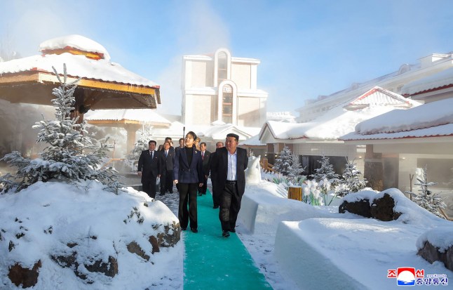 This picture taken on December 20, 2025 and released by North Korea's official Korean Central News Agency (KCNA) via KNS on December 23, 2025 shows North Korean leader Kim Jong Un (R) and his daughter Ju Ae (L) inspecting the Milyong Hotel, which was recently completed in the Samjiyon tourist district of Ryanggang Province. (Photo by KCNA VIA KNS / AFP via Getty Images) / South Korea OUT / ---EDITORS NOTE--- RESTRICTED TO EDITORIAL USE - MANDATORY CREDIT "AFP PHOTO/KCNA VIA KNS" - NO MARKETING NO ADVERTISING CAMPAIGNS - DISTRIBUTED AS A SERVICE TO CLIENTS THIS PICTURE WAS MADE AVAILABLE BY A THIRD PARTY. AFP CAN NOT INDEPENDENTLY VERIFY THE AUTHENTICITY, LOCATION, DATE AND CONTENT OF THIS IMAGE. /