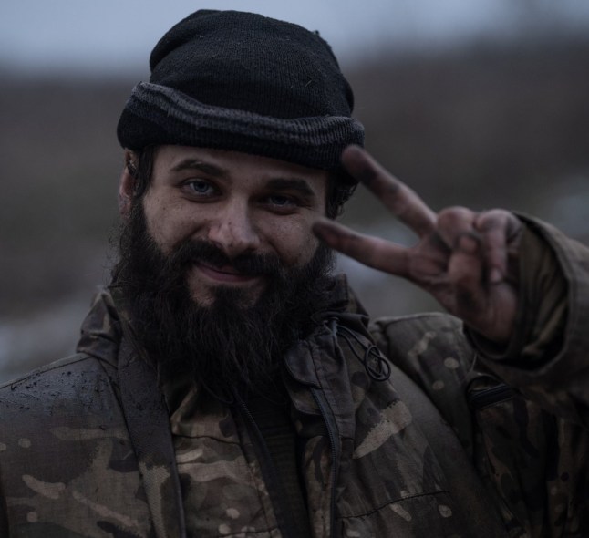 A Ukrainian soldier pictured with a haunting stare as he returned from the frontline has revealed how he had to dig himself out after being buried in an explosion. Dmitry, 30, said he and his comrades killed seven Russian soldiers while they were at the frontline in the defence of embattled Kostyantynivka. The industrial city has been under heavy Russian attack as Vladimir Putin?s troops continue to grind away in eastern Ukraine. His position came under sustained enemy attack from First-Person View drones and mortars. Dmitry told Metro how he came to be trapped underground after one blast. I managed to gather myself and lie down on my side, pull my knees and elbows. There was a small space left under my body. And I started digging under myself - with a knife and my hands. Little by little, over the course of several hours, I dug myself out, so that I could even turn around. And then I began to notice that I smelled really bad. It turned out that there was an enemy corpse hanging above me, the first enemy who came to our hut. He was held by tree roots, he had no face, it was dripping all over me. The explosion threw his body out. A very unpleasant picture remained in my head.? Even after being buried alive, the pair continued to man their positions. **?**Then we changed positions,? Dmitry said. ?After that, I didn?t go out into the yard. **?**Bars? ran out for parcels, and I sat in a hole. And there you could either lie down or sit. **?**And in 26 days my legs atrophied. And then I had to cover a 10km route while leaving the positions. So I could barely drag my legs.? The comrades? war-weary image was flashed round the world after they were photographed, exhausted and arm-in-arm.
