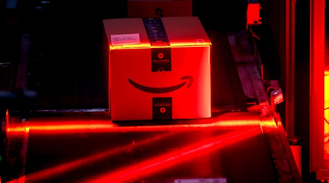 An automated bar code reader scans packages prepared for shipping at an Amazon fulfillment center on Cyber Monday in Robbinsville, New Jersey, US, on Monday, Dec. 1, 2025. US consumers are heading into the official start of the holiday shopping season with a host of economic concerns, including a cooling job market, stagnant wages, persistent inflation and the looming fallout from tariffs. Photographer: Michael Nagle/Bloomberg via Getty Images