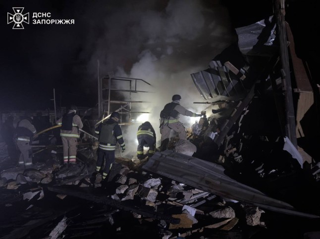 ZAPORIZHZHIA, UKRAINE - DECEMBER 24: (----EDITORIAL USE ONLY - MANDATORY CREDIT - 'UKRAINIAN STATE EMERGENCY SERVICE / HANDOUT' - NO MARKETING NO ADVERTISING CAMPAIGNS - DISTRIBUTED AS A SERVICE TO CLIENTS----) A view of destroyed residential building as search and rescue and firefighting efforts continue after Russian forces carried out airstrikes on the city of Zaporizhzhia in Ukraine on December 24, 2025. According to authorities, at least four people were injured and received medical assistance. The strikes caused fires in a garage and a car, which were quickly extinguished by rescuers. The blast wave also partially damaged a fire station, administrative buildings, multi-storey residential buildings, an educational institution and several vehicles. (Photo by State Emergency Service of Ukraine / Handout/Anadolu via Getty Images)