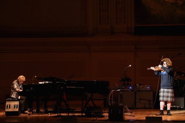 NEW YORK, NY - MARCH 05: Musicians Maybelle Chisholm McQueen (L) and Ashley MacIsaac perform on stage at Tibet House Benefit Concert 2015 at Carnegie Hall on March 5, 2015 in New York City. (Photo by Neilson Barnard/Getty Images for Tibet House)