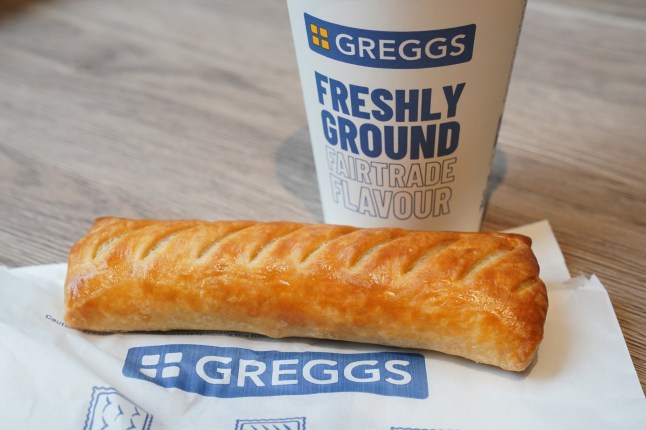 A cup of coffee and a sausage roll in a Greggs shop on the Strand in London. Greggs has warned that the rising cost of employing people will result in price rises across its range as it said "lower consumer confidence" late last year had hit sales. Picture date: Wednesday January 8, 2025. PA Photo. See PA story CITY Greggs. Photo credit should read: Jonathan Brady/PA Wire