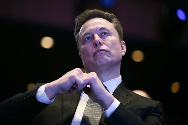 Elon Musk looks on as US President Donald Trump speaks at the US-Saudi Investment Forum at the John F. Kennedy Center for the Performing Arts in Washington, DC on November 19, 2025. (Photo by Brendan SMIALOWSKI / AFP) (Photo by BRENDAN SMIALOWSKI/AFP via Getty Images)