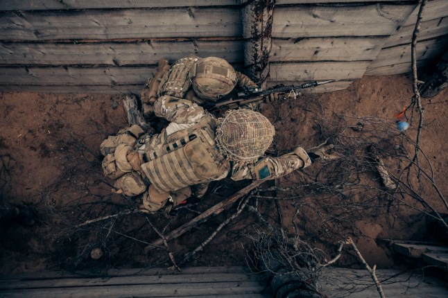 Soldiers from B Company, 3rd Battalion, The Parachute Regiment, throw a practise grenade as they clear their way through the enemy trench system by during a combined arms live-fire exercise (CALFEX) phase of Exercise Swift Response on the 4th of May 2024. 16 Air Assault Brigade Combat Team, the British Army?s global response force, is leading a force of more than 2,300 soldiers, sailors and aviators from four countries working together in Estonia on Exercise Swift Response. The training is about NATO airborne forces building their ability to respond together to crises. It is part of Steadfast Defender 24, NATO?s largest military exercise since the Cold War, which involves approximately 90,000 troops from all 32 NATO allies