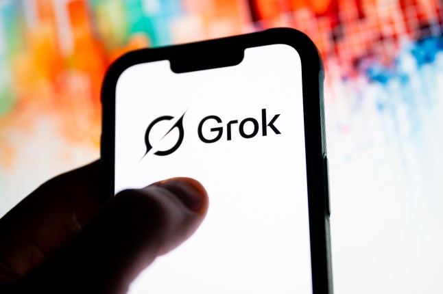 In this photo illustration, a Grok logo seen displayed on a